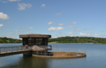 Water treatment facility structure and reservoir infrastructure representing investment and technology adoption in the UK water sector.